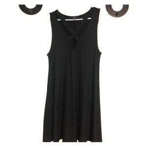 Black dress. Cross cross chest.